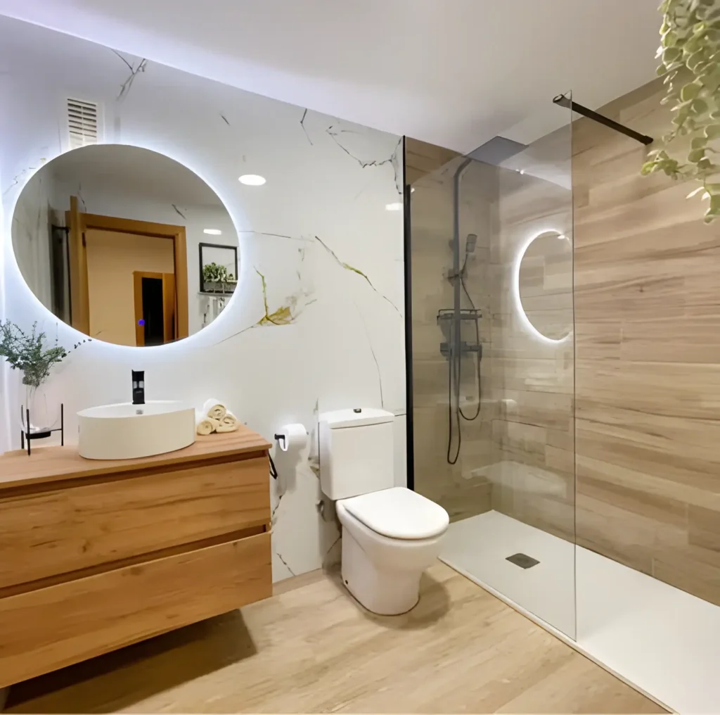 Baño reformado en Getafe con mampara y grifería nueva